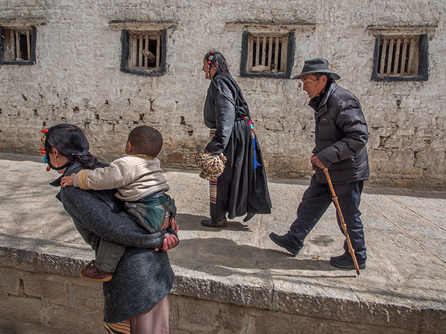 Buddhist pilgrims walking from small mountain villages to Sera Monastery in Lhasa   Oly OM-D E-M1 9-18mm
