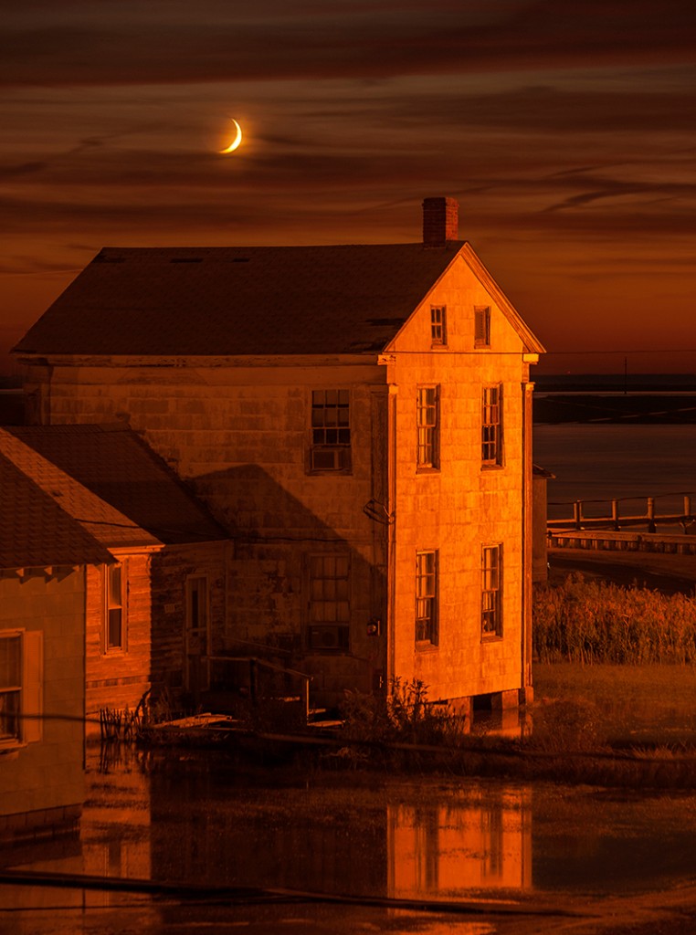 A partial moon sets over Tylerton on Smith Island       Photo by Jay Dickman