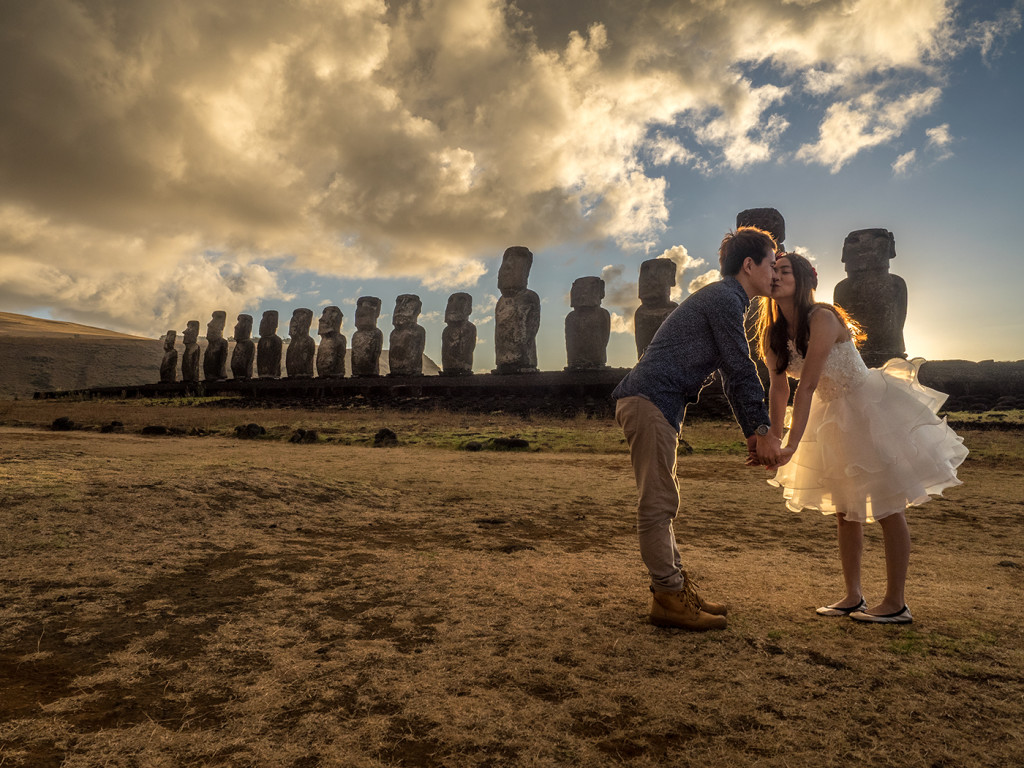 Young couple posing for photos at Ahu Tongariki on Easter Island