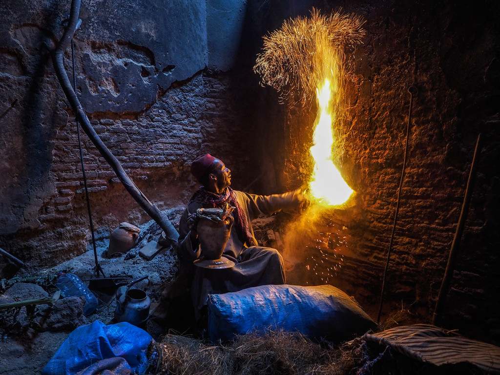 Man who keeps fire going in "Farnatchi (furnace) that heats water in public baths. E-M1 12-40mm Pro