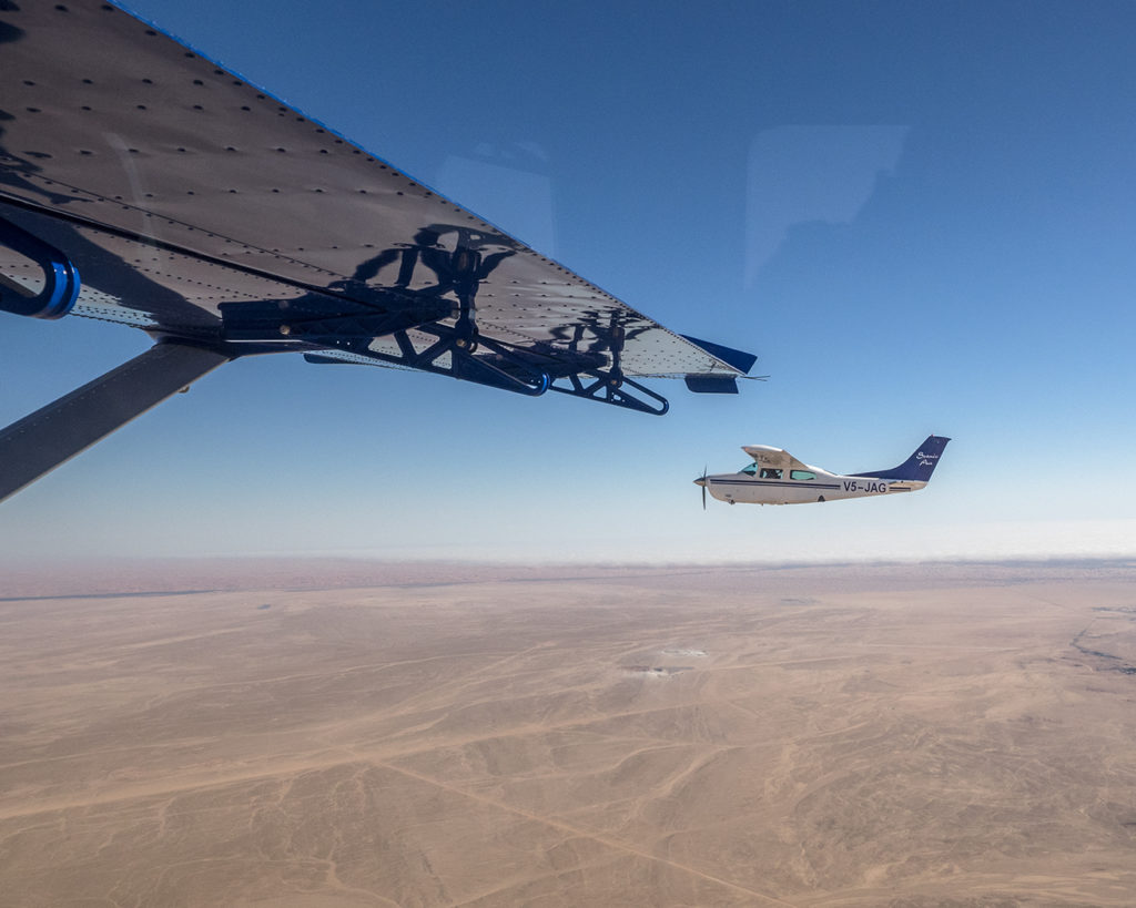 Cessna 210 seen from our Kodiak, flying into Luderitz